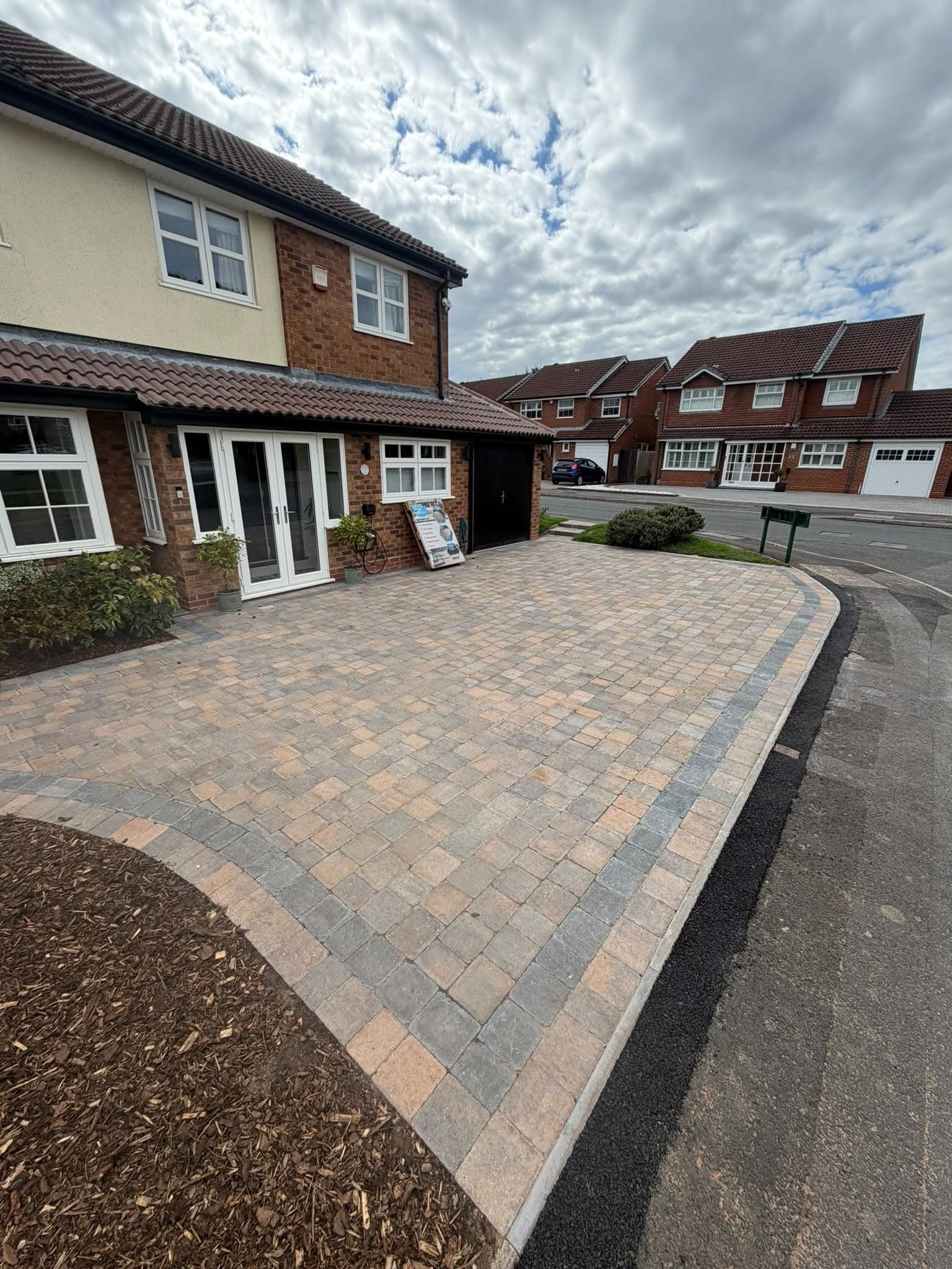 Block paved front driveway with a contrasting charcoal border