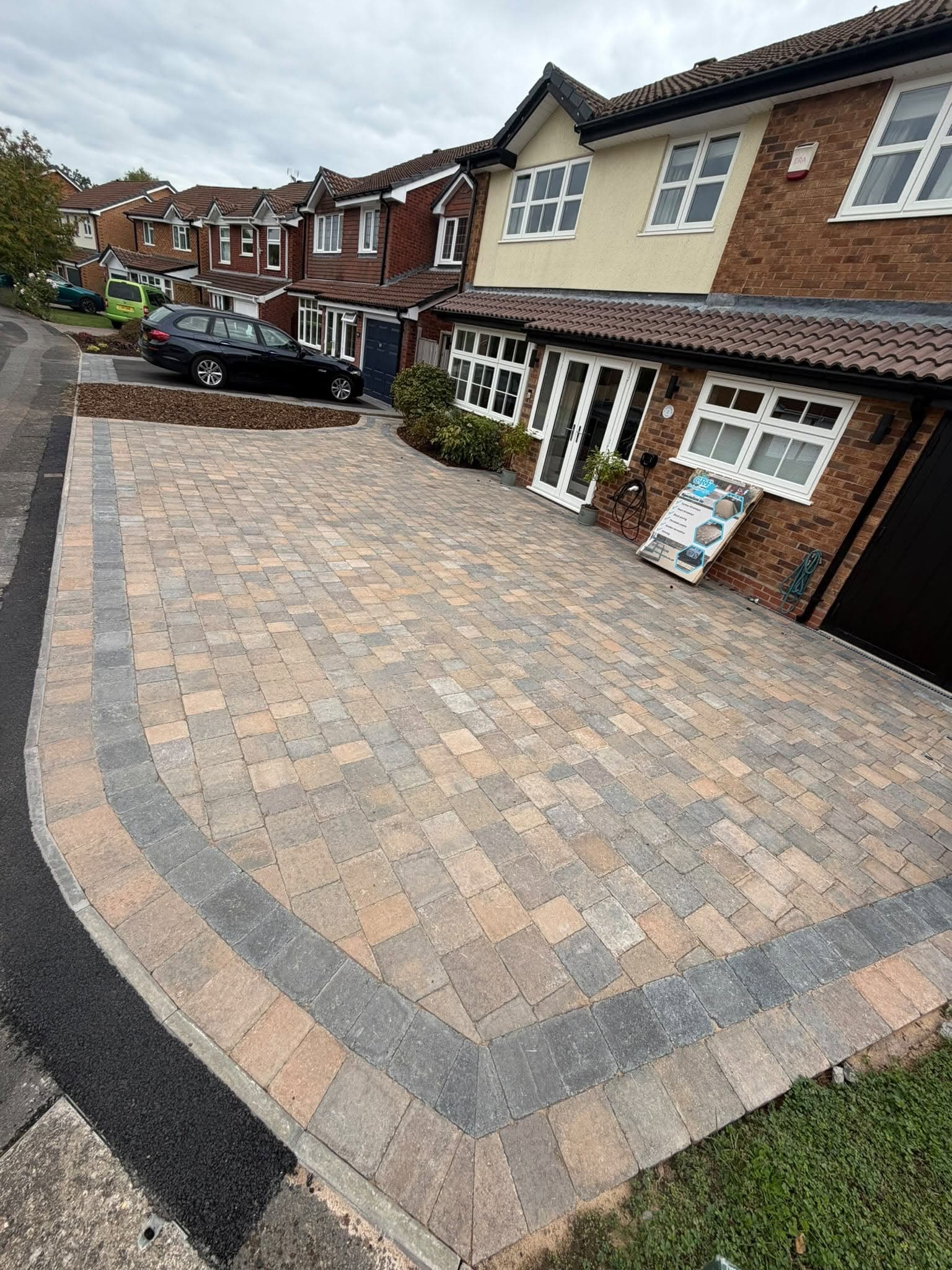 Detailed block paved driveway with curved border
