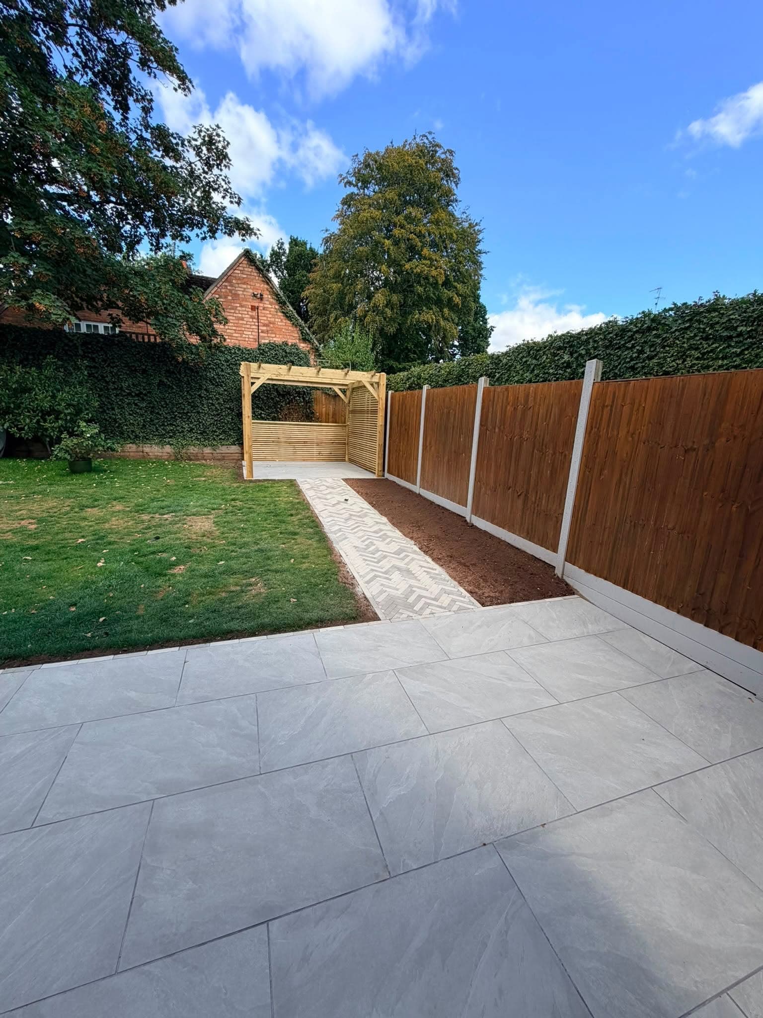 Landscaped garden with new paving, lawn and timber fencing