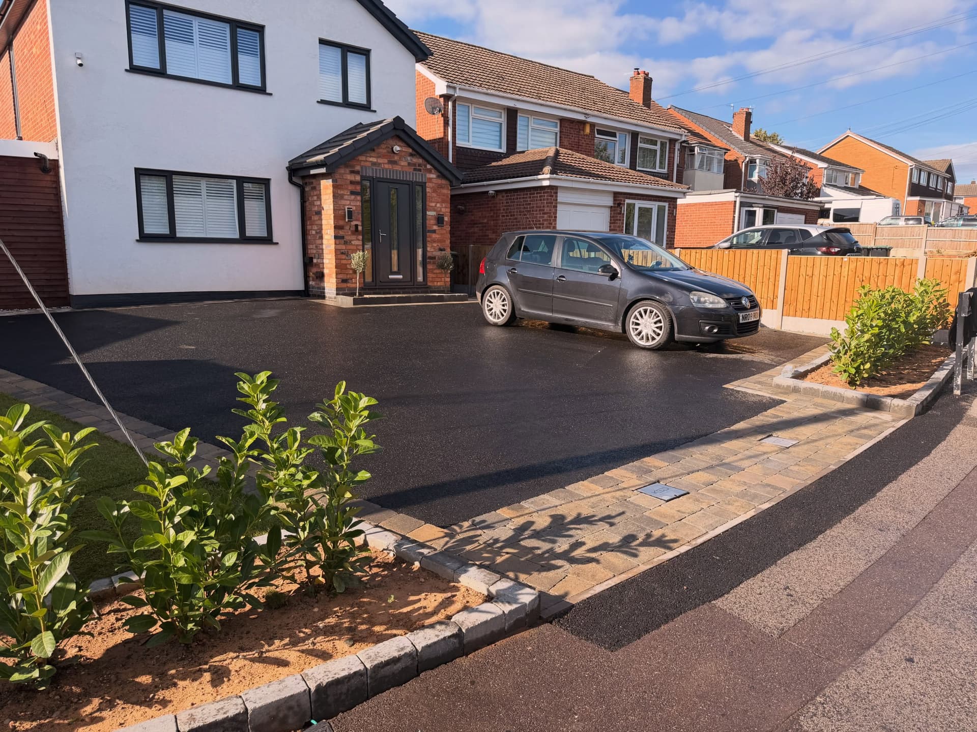 Completed tarmac driveway with block paving detail by CRF Driveways